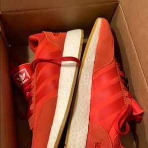 Red Adidas sneakers